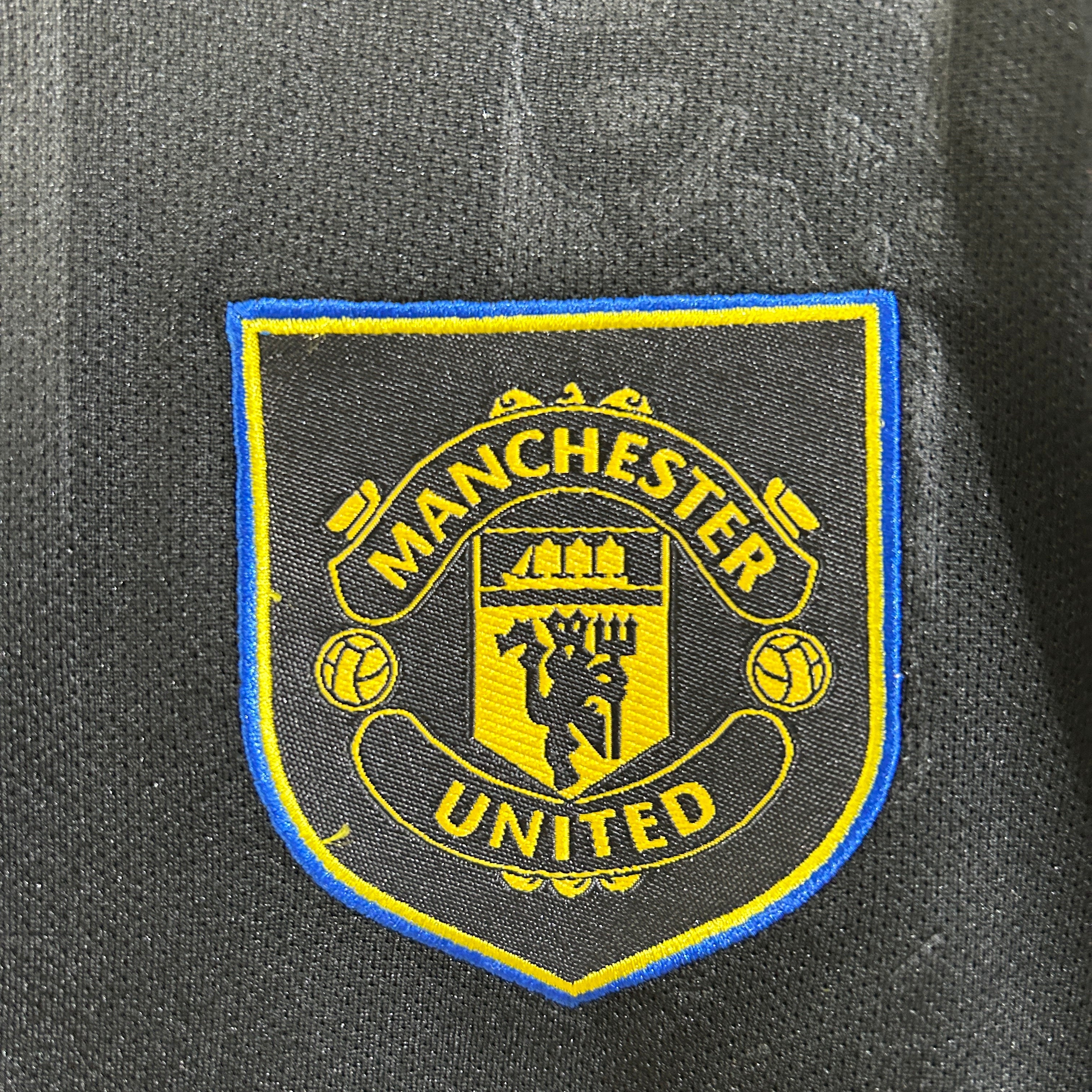 Kit Criança Alternativo Preto Manchester United 2025/2026